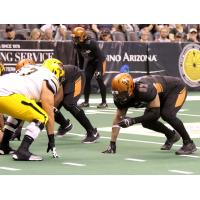 Nikolaus D'Avanzo of the Arizona Rattlers (right) lines up against the Tucson Sugar Skulls