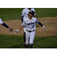 Mike Fransoso of the Somerset Patriots receives congratulations after his home run