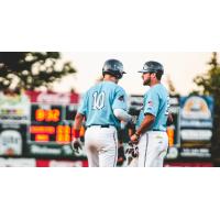 St. Cloud Rox assistant coach Alex Miklos talks with pitcher Hance Smith (10)
