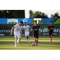 Victor Rodriguez of Seattle Sounders FC with possession vs. the Portland Timbers
