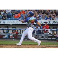 Tim Tebow of the Syracuse Mets (in SpongeBob SquarePants jersey) watches his home-run ball fly over the center-field wall