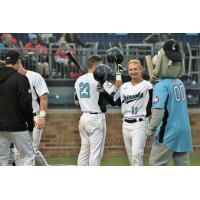 Lakeshore Chinooks infielders Daryl Myers (23) and Cole Barr (11)