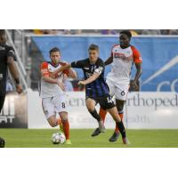 Colorado Springs Switchbacks FC race for the ball vs. the Tulsa Roughnecks