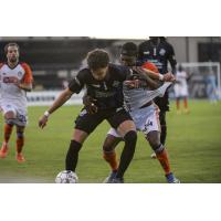 Colorado Springs Switchbacks FC battles the Tulsa Roughnecks for possession