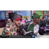 Mike Ryan (left) wearing a Fort Wayne TinCaps hat while on ESPNews