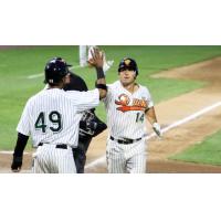 T.J. Rivera and D'Arby Myers exchange a high five