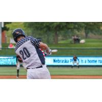 Lincoln Saltdogs catcher Tyler Moore connects with a pitch