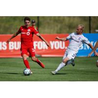 Forward Madison FC defender Eric Leonard (right) vs. Toronto FC II