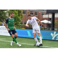 South Georgia Tormenta FC midfielder Charlie Dennis (right) vs. Greenville Triumph SC
