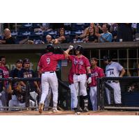 Trevor Larnach of the Pensacola Blue Wahoos returns to the dugout following his homer