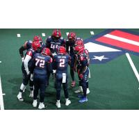 Washington Valor quarterback Arvell Nelson huddles up with his offense