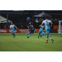 Sacramento Republic FC midfielder Drew Skundrich (center) against Las Vegas Lights FC