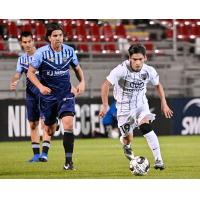 San Antonio FC midfielder Cristian Parano (right) vs. Fresno FC