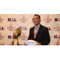 Jacksonville Sharks head coach Siaha Burley with the Coach of the Year award