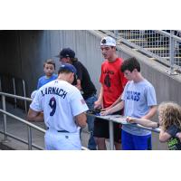 Trevor Larnach of the Pensacola Blue Wahoos signs autographs