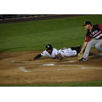 Michael Crouse of the Somerset Patriots scores on a wild pitch