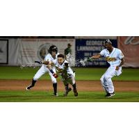 Livan Soto gets a mini Gatorade shower from Burlington Bees teammates Rayneldy Rosario and Eduardo Del Rosario