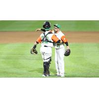 Long Island Ducks pitcher Seth Simmons gets a hug from catcher Ramon Cabrera