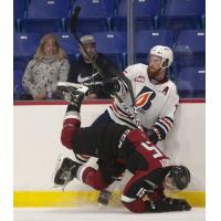 Vancouver Giants left wing Owen Hardy battles the Kamloops Blazers