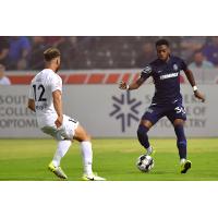 Marcus Epps of Memphis 901 FC with possession against Saint Louis FC