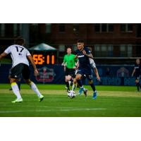 Pierre Da Silva of Memphis 901 FC with possession against Pittsburgh Riverhounds SC