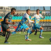 Las Vegas Lights FC captain Bryan De La Fuente (center)