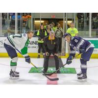 Dale Arnold prepares to drop the puck at 