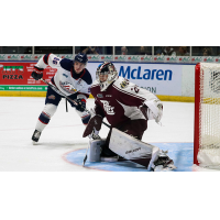 Peterborough Petes goaltender Hunter Jones faces Saginaw Spirit left wing Damien Giroux