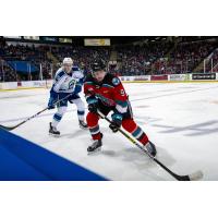 Kelowna Rockets left wing Mark Liwiski (right) vs. the Swift Current Broncos