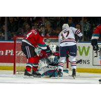 Kelowna Rockets goaltender Roman Basran smothers a shot against the Kamloops Blazers