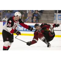Vancouver Giants left wing Jackson Shepard is thrown to the ice by the Prince George Cougars