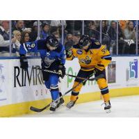 Atlanta Gladiators forward Eric Neiley (right) battles the Jacksonville IceMen along the boards