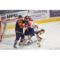 Macon Mayhem defenseman Oleg Khalemin battles the Peoria Rivermen in front of Macon goaltender Kevin Entmaa