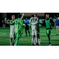 Real Monarchs SLC exchange congratulations after upsetting Phoenix FC in the playoffs