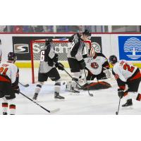 Vancouver Giants centre Evan Patrician (39) and centre Cole Shepard in front of the Medicine Hat Tigers goal