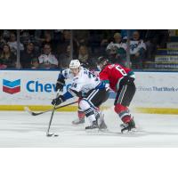 Kelowna Rockets defenceman Kaedan Korczak (right) battles the Victoria Royals