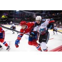 Kelowna Rockets defenceman Carson Sass (right) vs. the Spokane Chiefs