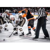 Lehigh Valley Phantoms forward Morgan Frost (right) battles the Hershey Bears