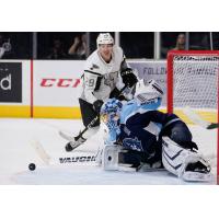 Jordan Kyrou of the San Antonio Rampage is stopped by Milwaukee Admirals goaltender Troy Grosenick