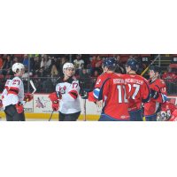 Marian Studenic (left) and Egor Sharangovich of the Binghamton Devils eye the Springfield Thunderbirds