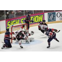 Jarret Kup of the Macon Mayhem (right) takes a shot against the Birmingham Bulls