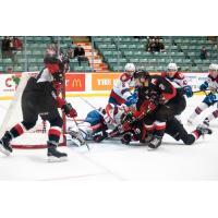 Prince George Cougars defenceman Cole Moberg (2) digs for the puck against the Edmonton Oil Kings