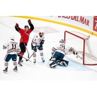 Prince George Cougars react during a goal against the Kamloops Blazers