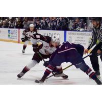 Vancouver Giants left wing Zack Ostapchuk (left) vs. the Tri-City Americans