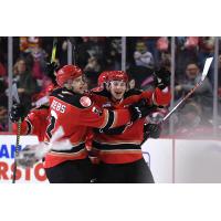 Carson Focht of the Calgary Hitmen celebrates his Teddy Bear Goal