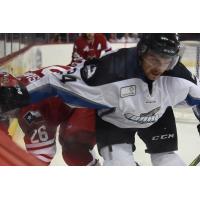 Spencer Asuchak of the Allen Americans (left) battles the Idaho Steelheads
