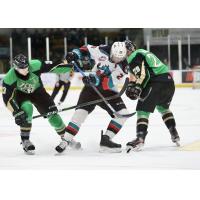 Kelowna Rockets left wing Nolan Foote (center) vs. the Prince Albert Raiders
