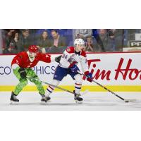 Vancouver Giants left wing Zach Ostapchuk (left) vs. the Spokane Chiefs