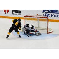 Kelowna Rockets goaltender Roman Basran stops Ty Thorpe of the Brandon Wheat Kings in the shootout