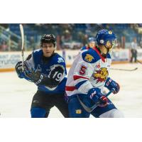 Saint John Sea Dogs centre Joshua Roy (left) vs. the Moncton Wildcats